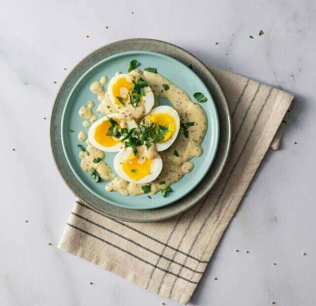 a plate of food with eggs on top of it